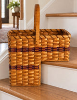 Large Step Basket wood-splint basket in Burgundy, lifestyle setting