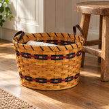 Small Round Laundry with Leather Handles wood-splint basket in Navy and Burgundy, lifestyle setting