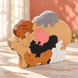 Pile of Pigs wooden puzzle from Troy Acres in a styled home setting