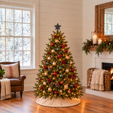 One Smokey Black punched tin star topper on a medium Christmas tree in a cozy winter room — K24-11SMQ6; sold as a set of six