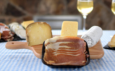 TAILGATERS GOURMET SELECTION - Cow Goat & Sheep Cheeses with Prosciutto on Cutting Board